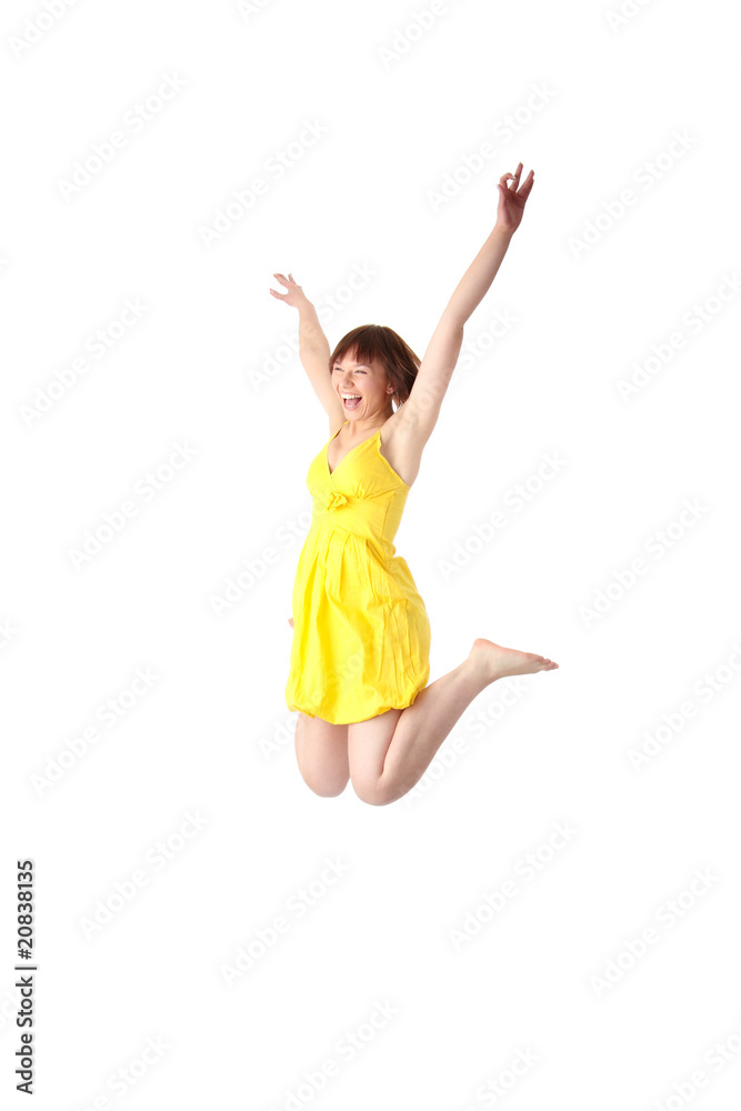 Young smiling teen girl jumping