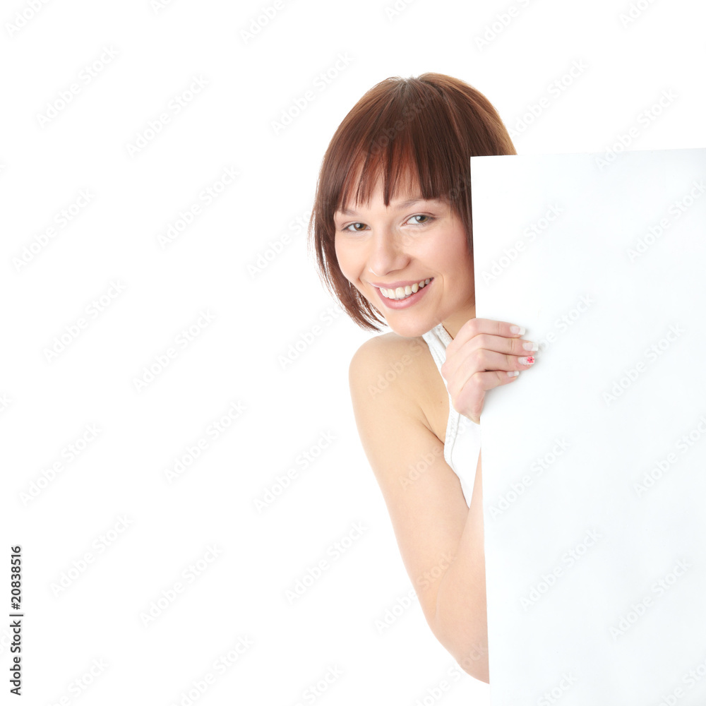 A pretty young woman holding a blank sign