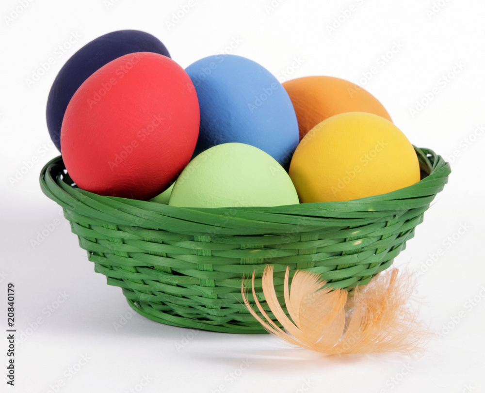The green Easter basket with painted eggs