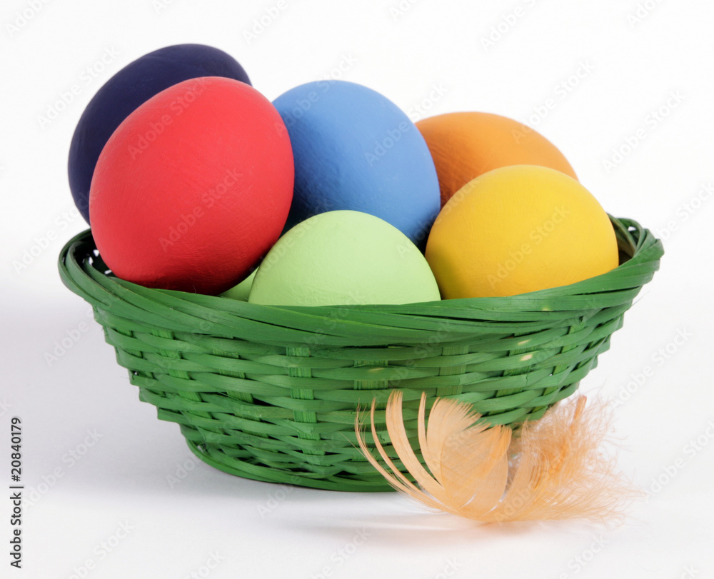 The green Easter basket with painted eggs The green Easter basket with painted eggs