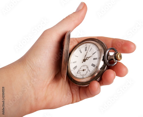 Silver pocket watch in hand