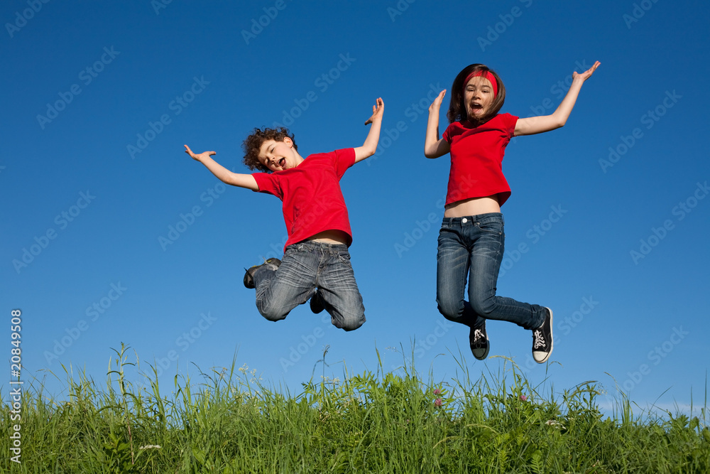 Girl and boy jumping, running outdoor Girl and boy jumping, running outdoor