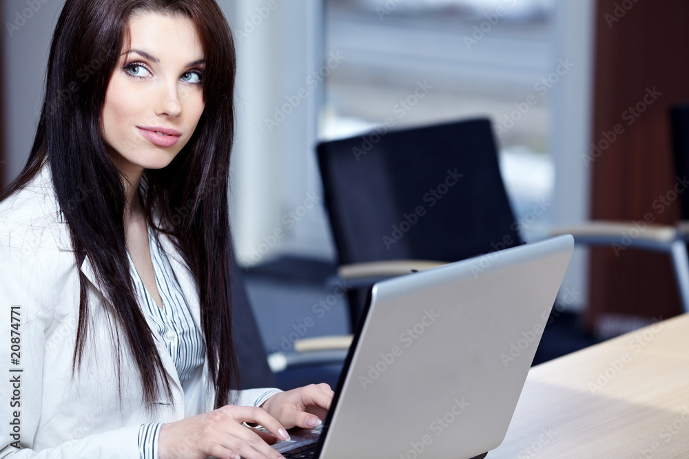 Beautiful business woman at the office smiling