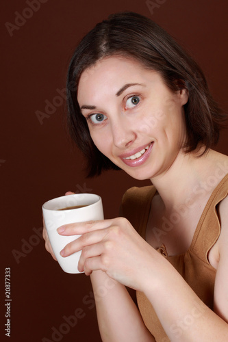 woman holding coffee cup