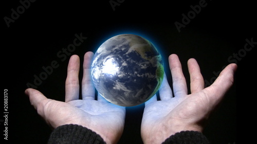 Holding planet earth in our hands photo