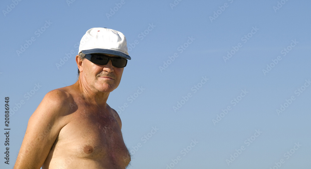 Senior Man relaxing in the beach Senior Man relaxing in the beach