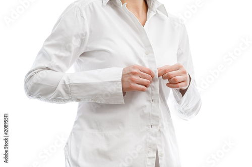 buttoning a white shirt