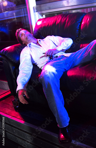 Young adult at a nightclub passed out