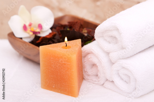 Aromatherapy candle, orchid and spa towels