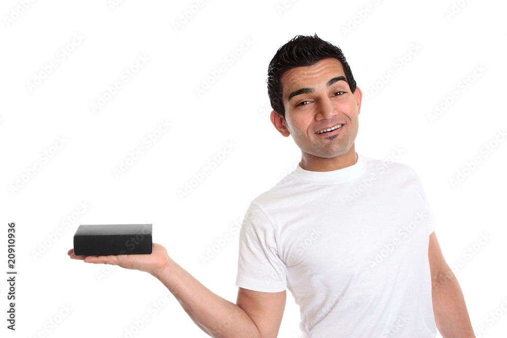 Man holding a product merchandise in one hand Man holding a product merchandise in one hand