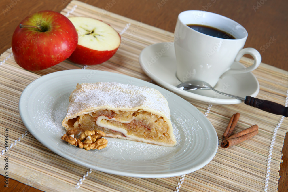 cup of coffee in white porcelain with apple strudel cup of coffee in white porcelain with apple strudel