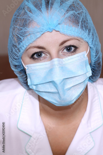 Closeup portrait of a young doctor wearing a mask