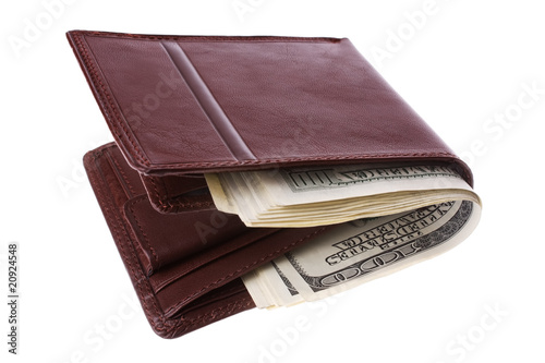 Brown leather wallet full of money. Isolated on white.