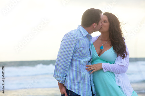 Young Pregnant Couple In Love