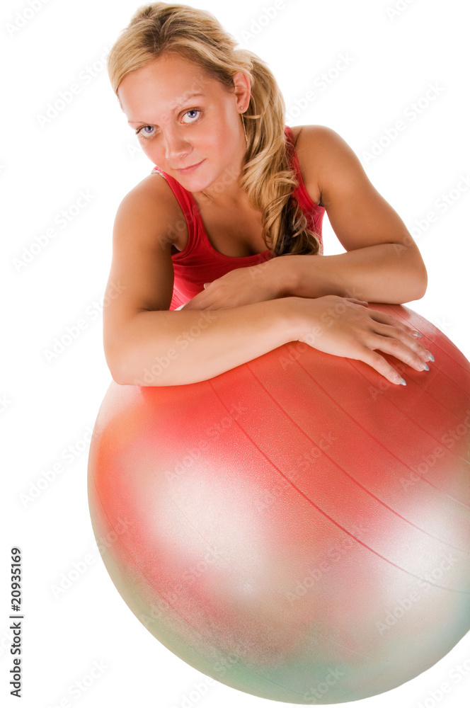 Blond woman exercising with a pilates ball Blond woman exercising with a pilates ball