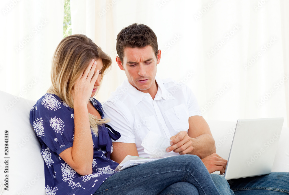 Distressed couple angry with so many bills to pay Distressed couple angry with so many bills to pay
