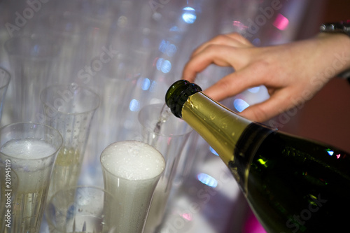 Filling Champagne Glasses Ready For Champagne Reception