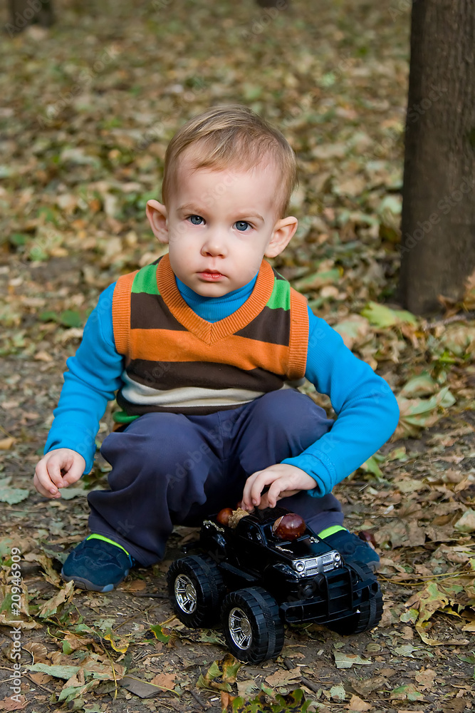 Little boy is playing with toy car Little boy is playing with toy car