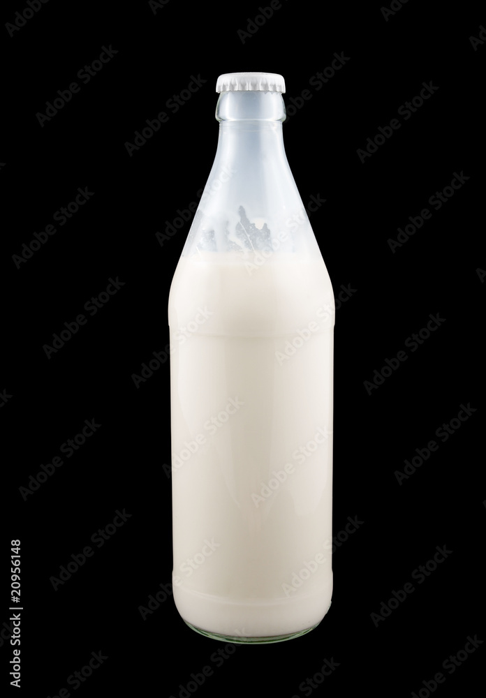 Milk in the bottle isolated on black background Milk in the bottle isolated on black background