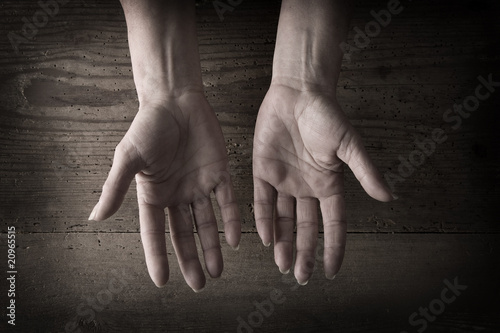 Hands and grainy wood