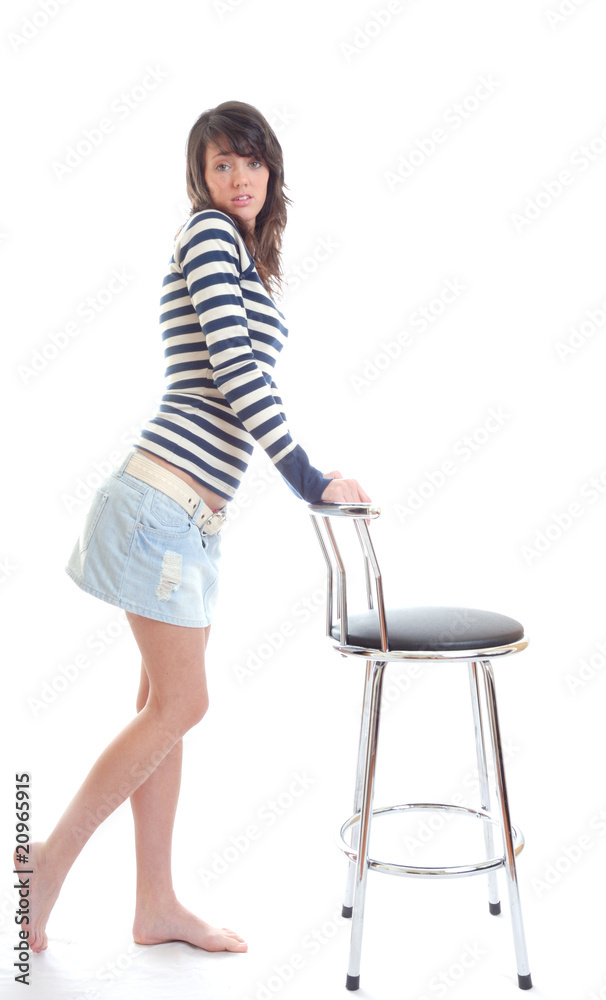 Pretty girl standing aginst chair Pretty girl standing aginst chair