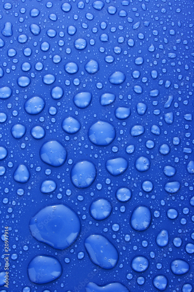 Blue water drops background with big and small drops