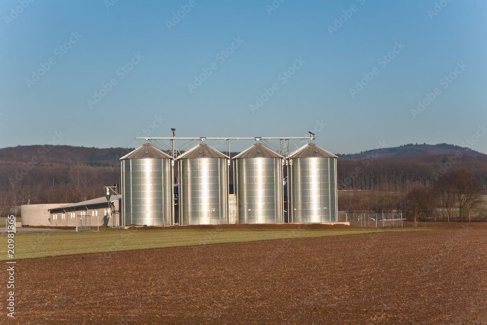 beautiful landscape with silo and snow white acre with blue sky beautiful landscape with silo and snow white acre with blue sky