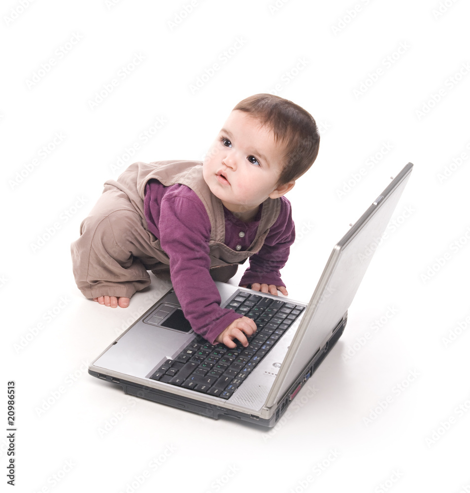 Baby girl with a laptop
