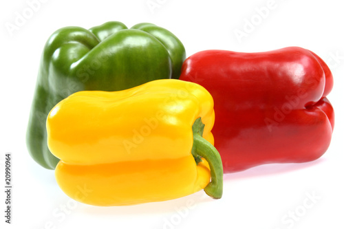 red, yellow and green paprika on white