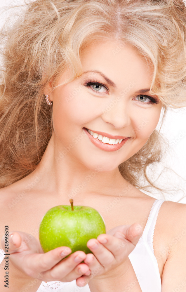 young beautiful woman with green apple young beautiful woman with green apple