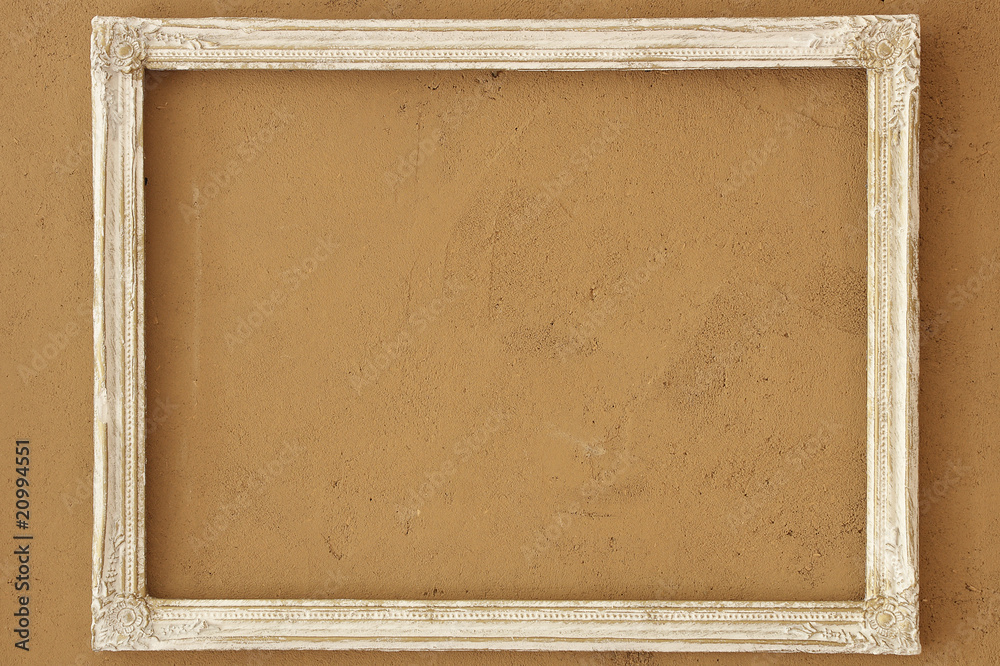 Fototapeta premium vintage picture frame on the clay wall