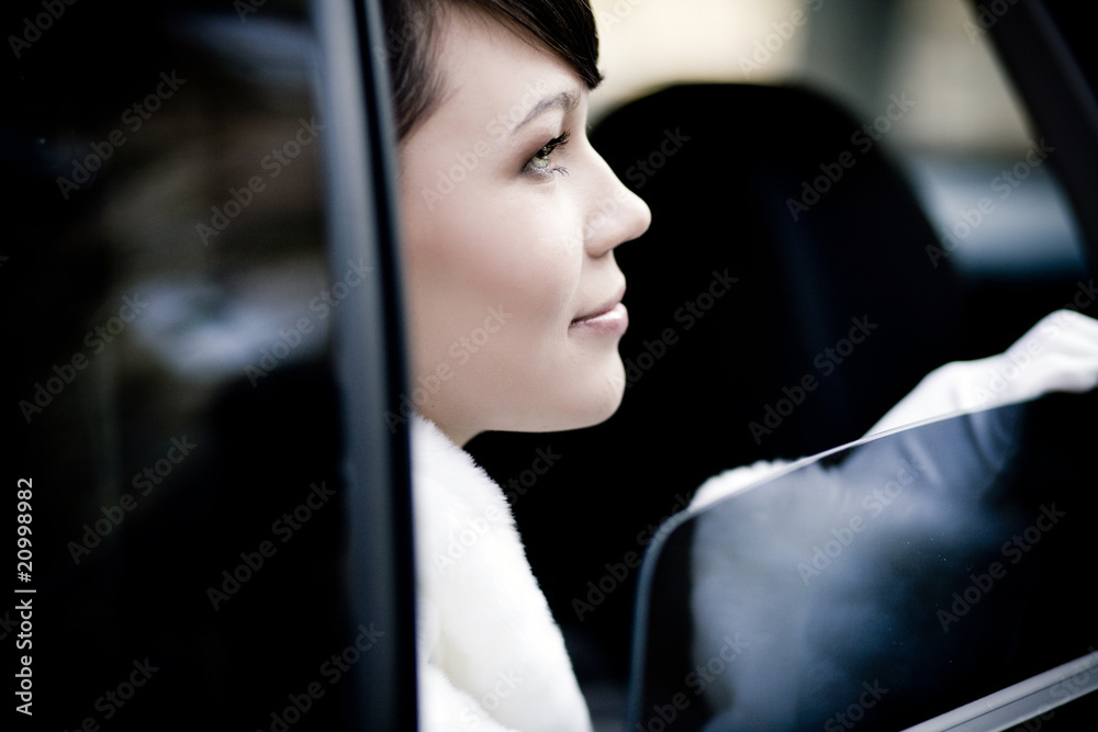 beautiful bride in the car