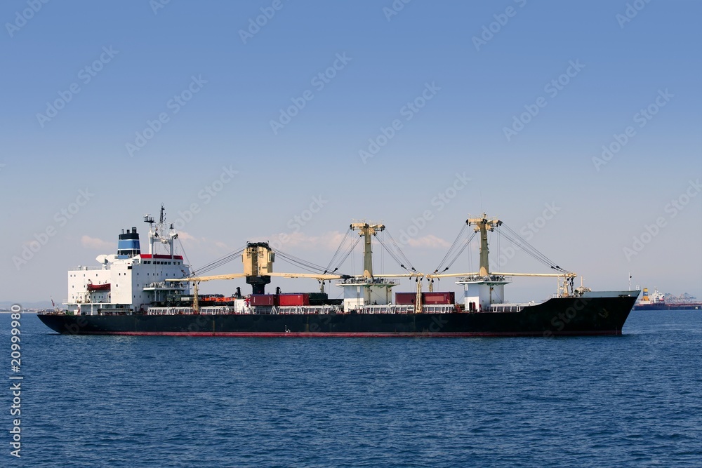 Cargo container freighter ship sailing in Mediterranean sea