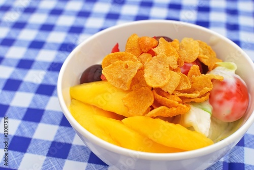 Healthy fruit salad topped with cereal