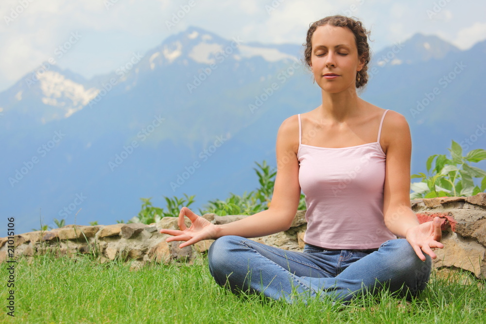 beautiful woman is meditate with OK hand gesture
