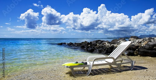 Tropical island beach with beach chair