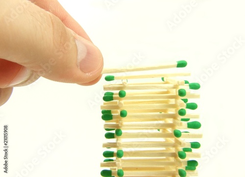 Human hand build matches tower
