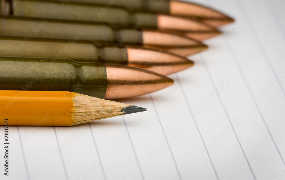 pencil and cartridges on notepad pencil and cartridges on notepad