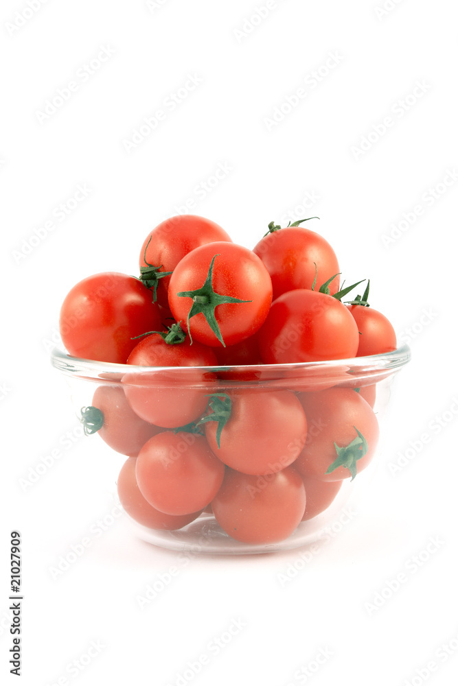 Red tomatoes on a plate on white background Red tomatoes on a plate on white background