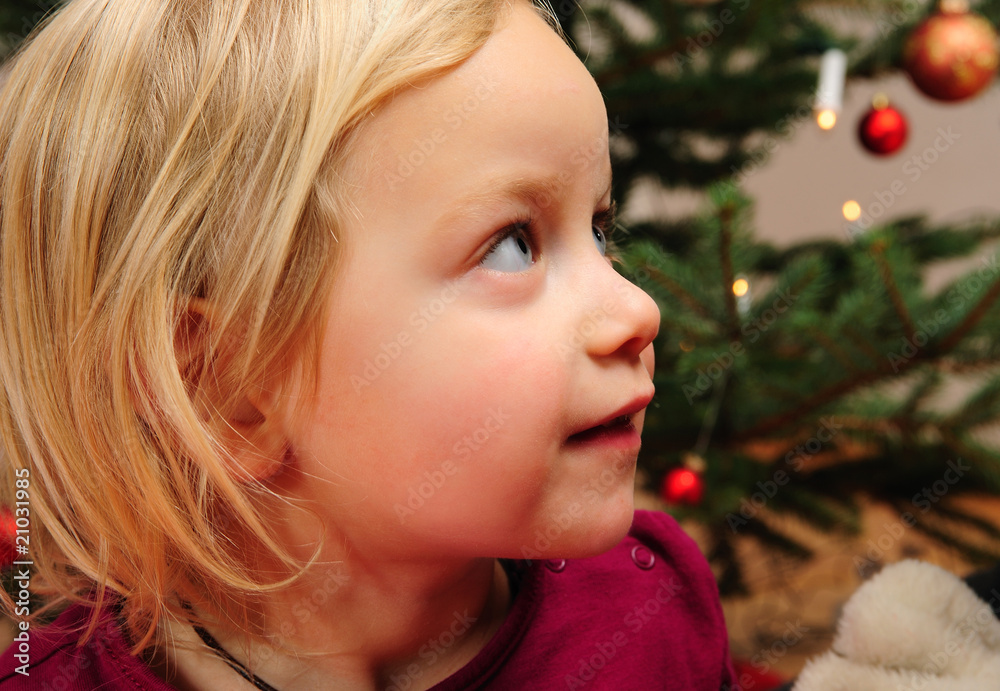 little girl in front of christmas tree little girl in front of christmas tree