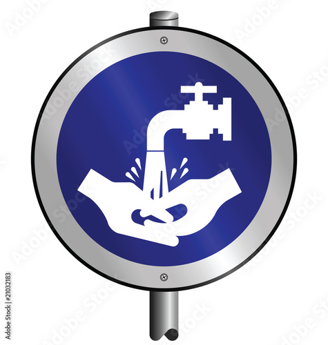 Mandatory wash hands sign mounted on post