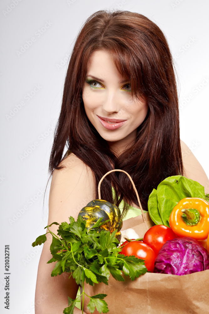 Smiling woman with fruits and vegetables. Over white background Smiling woman with fruits and vegetables. Over white background
