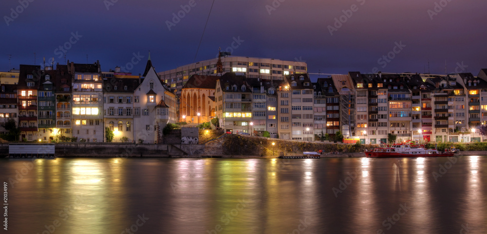 Basel waterfront on Rhine River at night, Switzerland