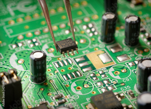 Obraz na płótnie Assembling a circuit board.