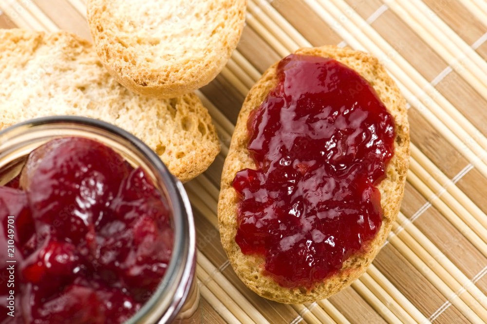 Breakfast of cherry jam on toast.