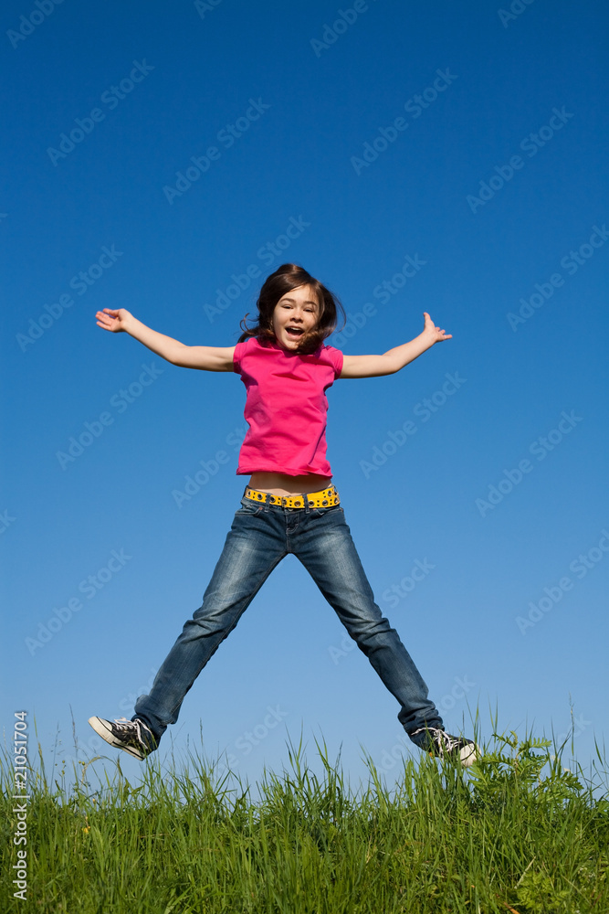Girl jumping, running against blue sky Girl jumping, running against blue sky