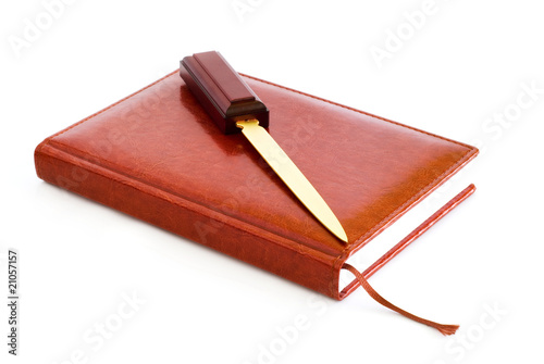 diary of skin, stationery knife, white background