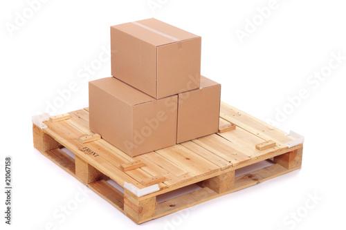 cardboard boxes on wooden palette