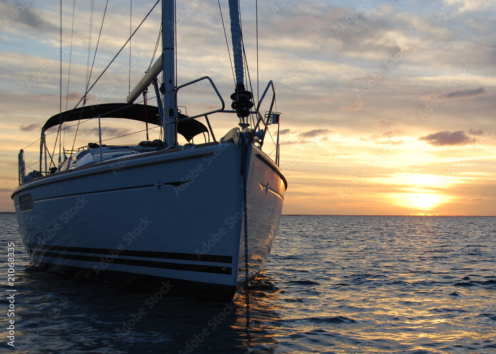 Fototapeta premium Sailboat Silhouette at Dusk with Sunset