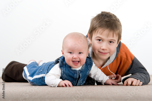 crawling baby girl and her brother